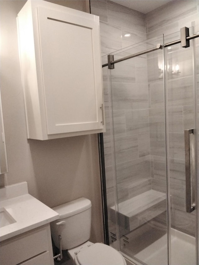 901 E Jefferson St, Van Alstyne, TX 75495 - bathroom with vanity, a shower stall, and toilet