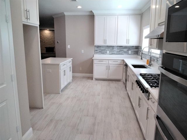 901 E Jefferson St, Van Alstyne, TX 75495 - kitchen featuring a sink, appliances with stainless steel finishes, exhaust hood, crown molding, and backsplash