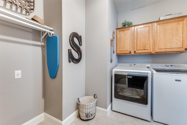 5801 Maidstone Dr, Richardson, TX 75082 - laundry room featuring cabinet space, separate washer and dryer, and light tile patterned flooring