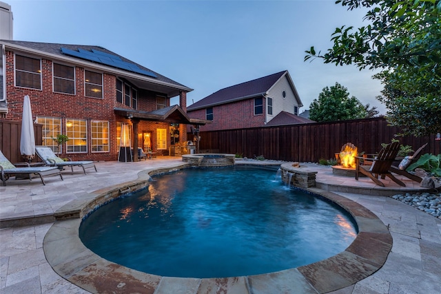 5801 Maidstone Dr, Richardson, TX 75082 - view of pool featuring a fire pit, a patio, a fenced backyard, and a pool with connected hot tub
