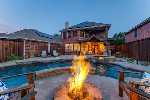 5801 Maidstone Dr, Richardson, TX 75082 - view of swimming pool with an outdoor fire pit, a fenced backyard, a patio, and a pool with connected hot tub