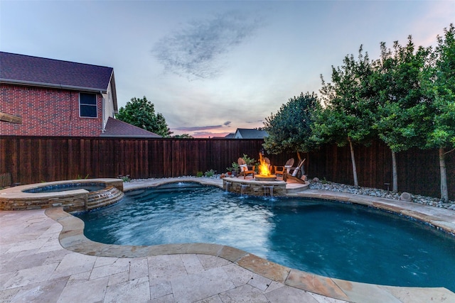 5801 Maidstone Dr, Richardson, TX 75082 - pool at dusk with a pool with connected hot tub, a fenced backyard, an outdoor fire pit, and a patio area