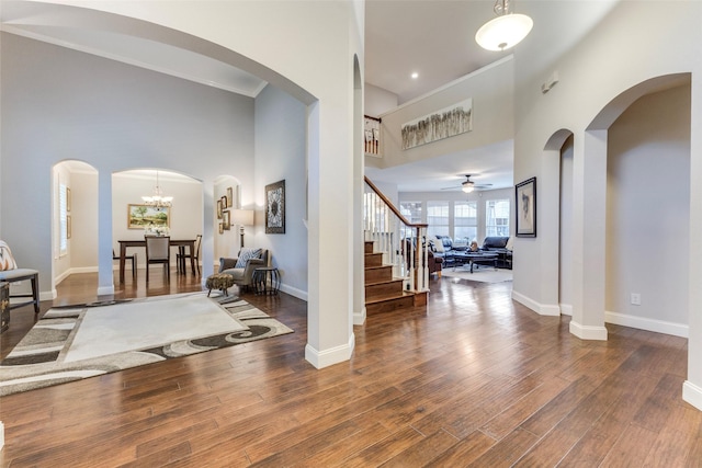 5801 Maidstone Dr, Richardson, TX 75082 - foyer entrance with stairs, a high ceiling, wood finished floors, and a ceiling fan