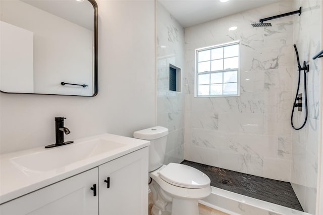 3524 Swan St, Haltom City, TX 76117 - bathroom featuring vanity, toilet, and a tile shower