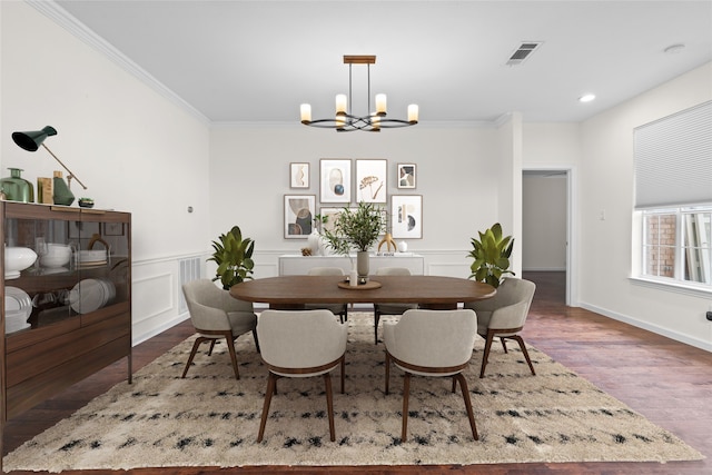 4688 Thanksgiving Ln, Plano, TX 75024 - dining area featuring a chandelier, crown molding, wood finished floors, a wainscoted wall, and recessed lighting