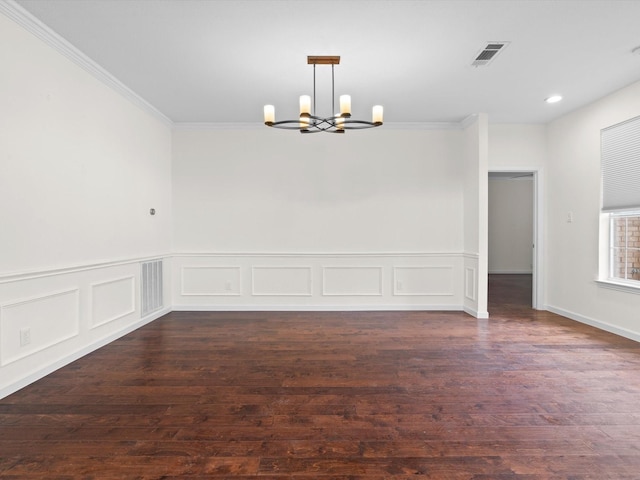 4688 Thanksgiving Ln, Plano, TX 75024 - spare room with a chandelier, dark wood-style floors, ornamental molding, a wainscoted wall, and a decorative wall