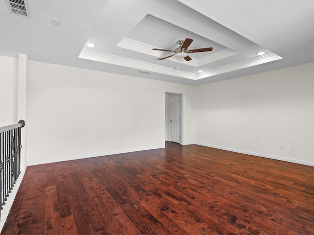 4688 Thanksgiving Ln, Plano, TX 75024 - spare room with crown molding, a raised ceiling, dark wood-type flooring, ceiling fan, and recessed lighting