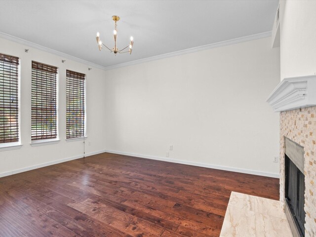4688 Thanksgiving Ln, Plano, TX 75024 - unfurnished living room with a chandelier, wood finished floors, a fireplace, crown molding, and baseboards