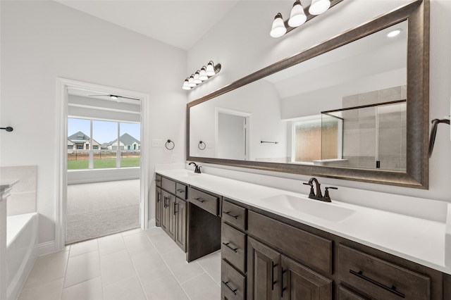 366 Paddle Boat Dr, Granbury, TX 76048 - full bathroom featuring double vanity, a garden tub, a shower stall, tile patterned flooring, and baseboards