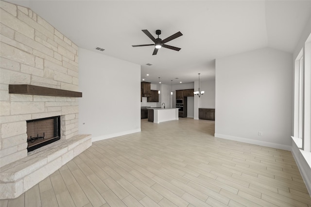 366 Paddle Boat Dr, Granbury, TX 76048 - unfurnished living room with a ceiling fan, a stone fireplace, baseboards, light wood-style floors, and recessed lighting