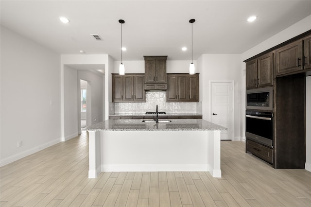 366 Paddle Boat Dr, Granbury, TX 76048 - kitchen with wall oven, backsplash, light wood-style floors, dark brown cabinetry, and recessed lighting