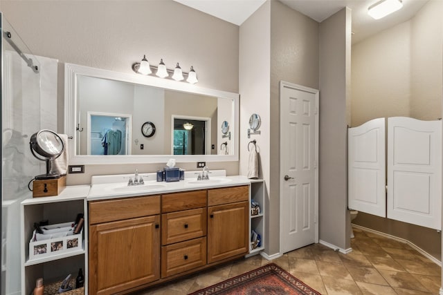 13137 Fencerow Rd, Fort Worth, TX 76244 - full bath featuring double vanity, tile patterned flooring, toilet, and baseboards