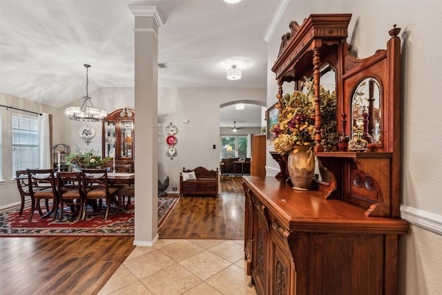 13137 Fencerow Rd, Fort Worth, TX 76244 - foyer with arched walkways, light tile patterned floors, a chandelier, and vaulted ceiling