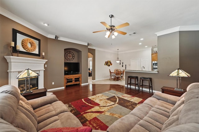 7917 Chapelwood Dr, North Richland Hills, TX 76182 - living area featuring arched walkways, ceiling fan, wood finished floors, baseboards, and recessed lighting