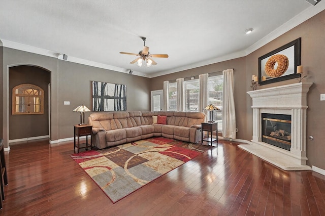 7917 Chapelwood Dr, North Richland Hills, TX 76182 - living room with a ceiling fan, arched walkways, baseboards, ornamental molding, and a high end fireplace