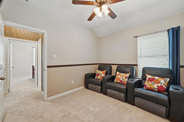 7917 Chapelwood Dr, North Richland Hills, TX 76182 - home theater featuring a ceiling fan, lofted ceiling, light colored carpet, and baseboards