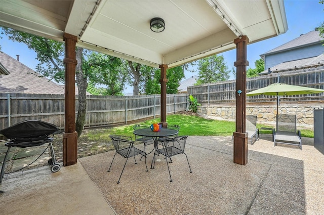 7917 Chapelwood Dr, North Richland Hills, TX 76182 - fenced backyard featuring a patio, outdoor dining space, and grilling area