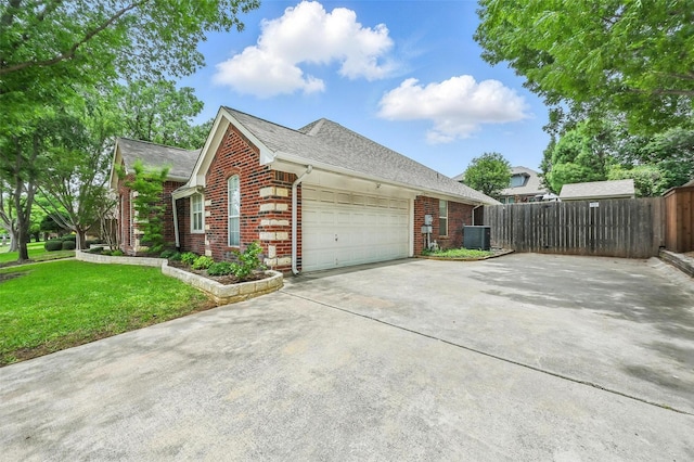 7917 Chapelwood Dr, North Richland Hills, TX 76182 - view of property exterior featuring brick siding, an attached garage, central AC, and concrete driveway