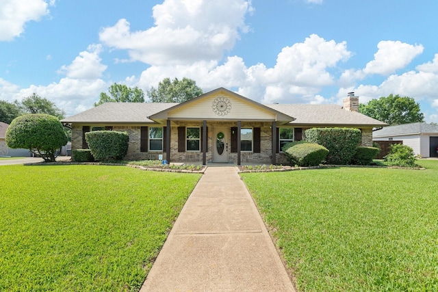 310 Singletree St, Highland Village, TX 75077 - single story home featuring a front lawn, brick siding, and covered porch
