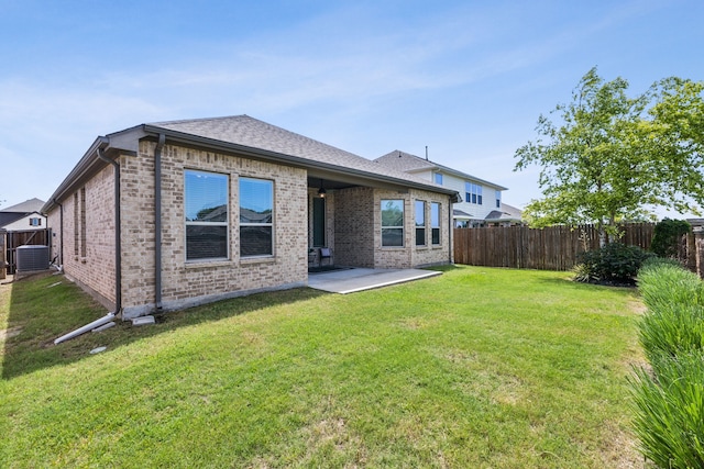 1117 Summer Ln, Mckinney, TX 75071 - rear view of property featuring a patio area, brick siding, and cooling unit