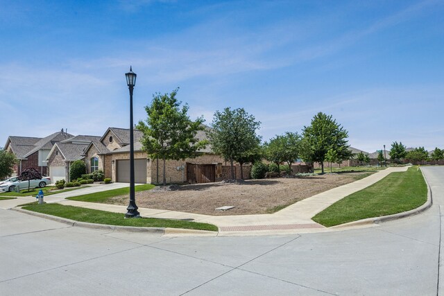 1117 Summer Ln, Mckinney, TX 75071 - view of front of home featuring a garage, concrete driveway, and brick siding