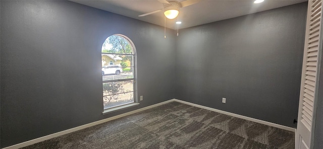 402 Ivy Way, Garland, TX 75043 - empty room featuring a ceiling fan, dark carpet, baseboards, and recessed lighting