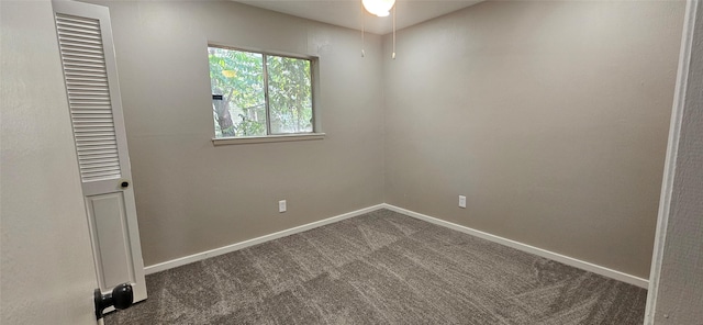 402 Ivy Way, Garland, TX 75043 - spare room with dark carpet and baseboards