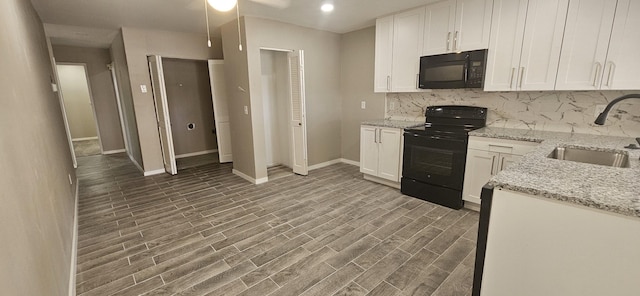 402 Ivy Way, Garland, TX 75043 - kitchen with black appliances, a sink, tasteful backsplash, baseboards, and white cabinetry