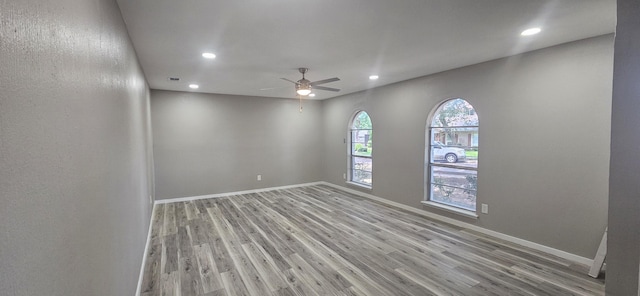 402 Ivy Way, Garland, TX 75043 - empty room featuring light wood-type flooring, a ceiling fan, recessed lighting, and baseboards