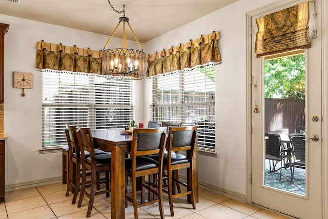 1765 Mustang Trl, Frisco, TX 75033 - dining space featuring a chandelier, light tile patterned flooring, and baseboards