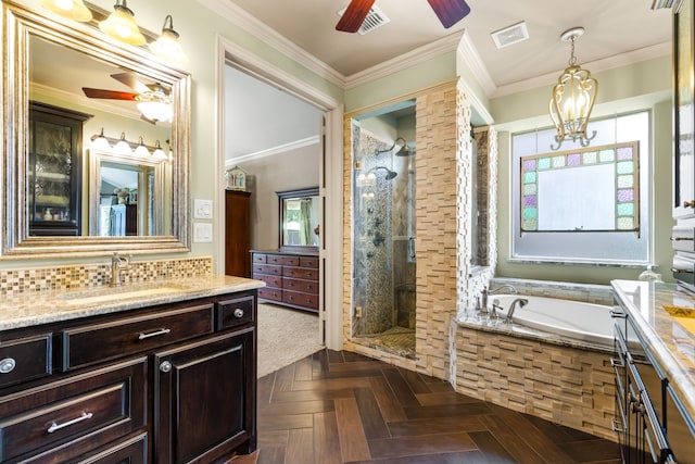 1765 Mustang Trl, Frisco, TX 75033 - bathroom with ceiling fan, vanity, a stall shower, a bath, and crown molding