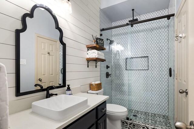 1765 Mustang Trl, Frisco, TX 75033 - full bathroom with vanity, a stall shower, toilet, wood walls, and tile patterned floors
