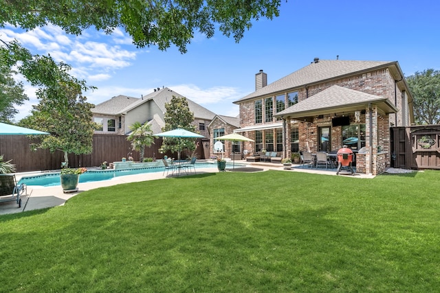 1765 Mustang Trl, Frisco, TX 75033 - rear view of house with a patio area, a chimney, brick siding, roof with shingles, and outdoor lounge area