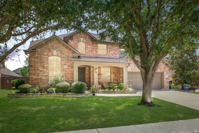 1765 Mustang Trl, Frisco, TX 75033 - traditional-style house with concrete driveway, brick siding, a front lawn, and a shingled roof