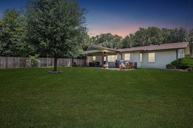 12305 Sunland St, Dallas, TX 75218 - back of property with a patio area and brick siding