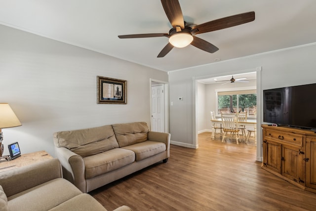 12305 Sunland St, Dallas, TX 75218 - living room featuring ceiling fan, wood finished floors, crown molding, and baseboards