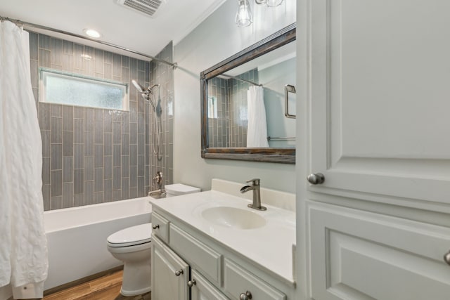 12305 Sunland St, Dallas, TX 75218 - bathroom featuring vanity, toilet, wood finished floors, shower / bath combo with shower curtain, and recessed lighting