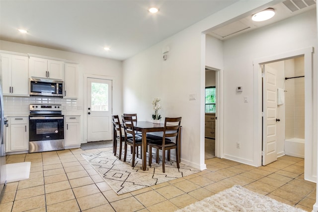 408 Peabody St, Hillsboro, TX 76645 - dining room featuring light tile patterned floors and recessed lighting