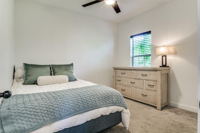 408 Peabody St, Hillsboro, TX 76645 - bedroom featuring light colored carpet, ceiling fan, and baseboards