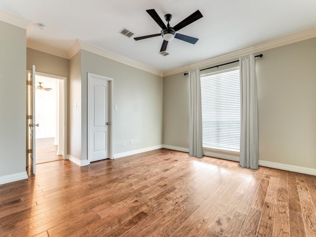 6500 Bolliger Ct, Frisco, TX 75035 - unfurnished room featuring ornamental molding, a ceiling fan, wood finished floors, and baseboards
