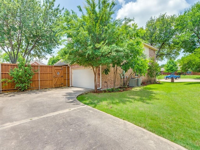 6500 Bolliger Ct, Frisco, TX 75035 - view of home's exterior with concrete driveway, central AC, brick siding, and a garage
