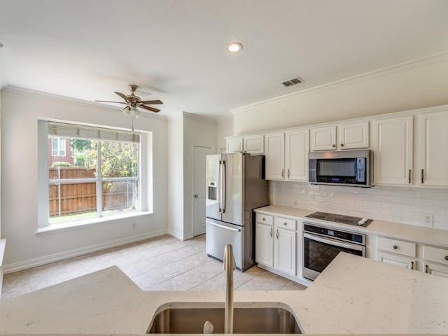 6500 Bolliger Ct, Frisco, TX 75035 - unfurnished living room featuring a ceiling fan, a fireplace with raised hearth, wood finished floors, high vaulted ceiling, and crown molding