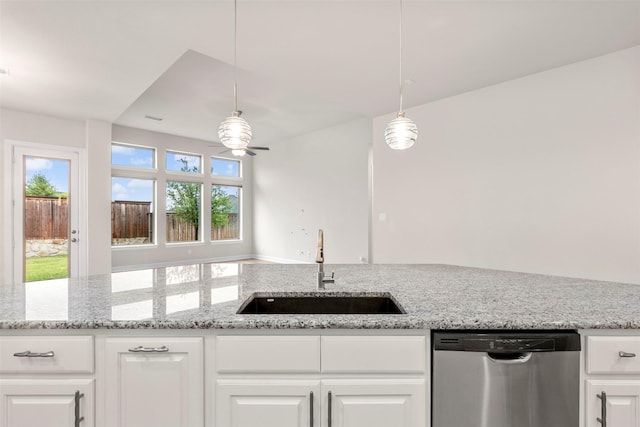 1725 Rolling Heights Ln, Fort Worth, TX 76008 - kitchen with stainless steel dishwasher, a sink, a ceiling fan, white cabinets, and light stone counters