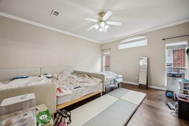 4077 Truman Dr, Frisco, TX 75034 - bedroom featuring wood finished floors, ornamental molding, baseboards, and a ceiling fan