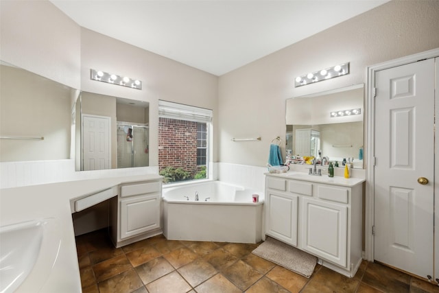 4077 Truman Dr, Frisco, TX 75034 - full bathroom featuring a stall shower, two vanities, a bath, and stone finish flooring
