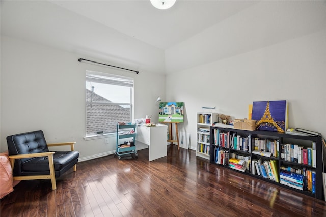 4077 Truman Dr, Frisco, TX 75034 - living area with wood finished floors, lofted ceiling, and baseboards