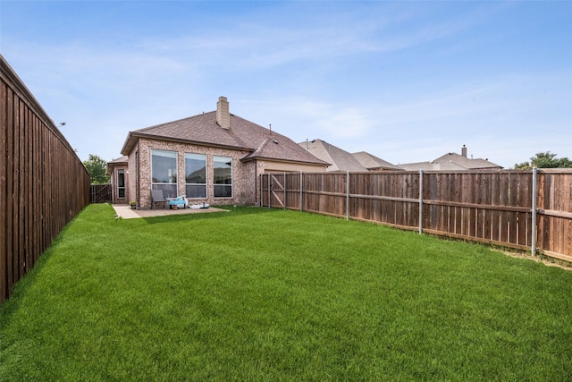 4077 Truman Dr, Frisco, TX 75034 - rear view of house featuring a patio area, brick siding, a chimney, and roof with shingles