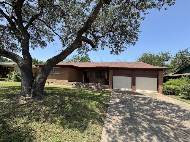 4920 Rector Ave, Fort Worth, TX 76133 - ranch-style house featuring brick siding, an attached garage, driveway, a front yard, and board and batten siding