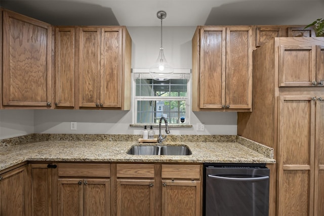 3208 Travis Ave, Fort Worth, TX 76110 - kitchen with stainless steel dishwasher, a sink, hanging light fixtures, brown cabinetry, and light stone countertops
