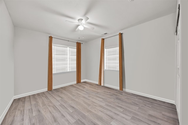 3208 Travis Ave, Fort Worth, TX 76110 - empty room with light wood-style floors, a ceiling fan, and baseboards